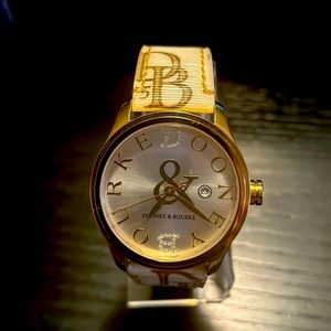 Dooney & Bourke tan and cream watch.  Canvas strap with DB initials. Beautiful